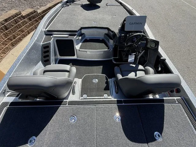 Slide: The Image of 2026 Ikon Boats VLX20 interior with Garmin system, featuring dual seats and spacious deck. - 5