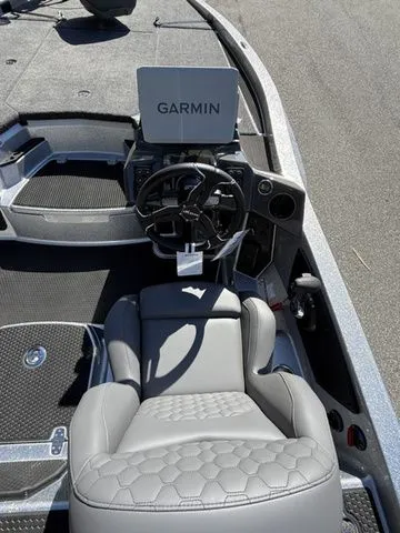 Slide: The Image of 2026 Ikon Boats VLX20 cockpit with Garmin navigation system and luxurious seating. - 6