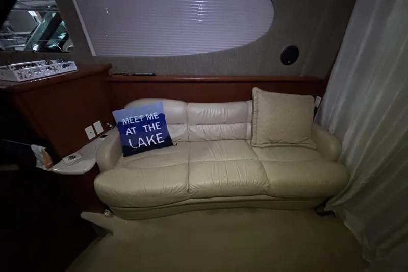 Slide: The Image of 2005 Silverton 34 Convertible yacht kitchen with wood cabinetry, microwave, and compact appliances. - 21