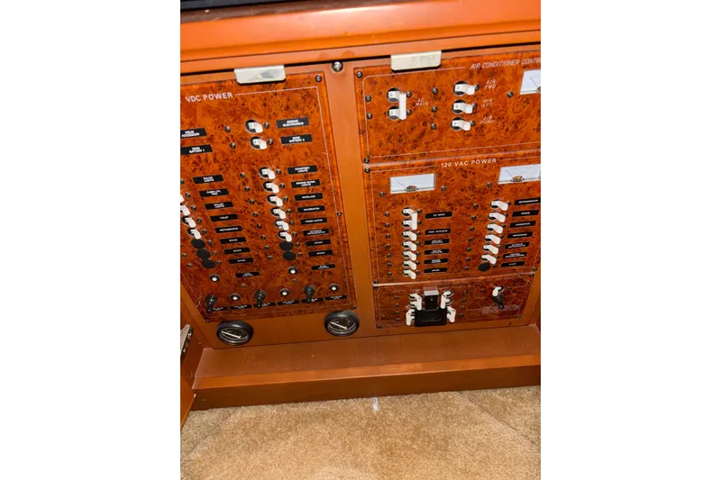 Slide: The Image of 2005 Silverton 34 Convertible cabin with cozy bunk beds and beige bedding. - 22