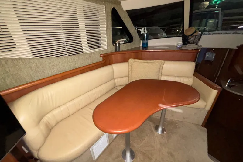 Slide: The Image of 2005 Silverton 34 Convertible cabin with bunk beds and compact fan. - 23