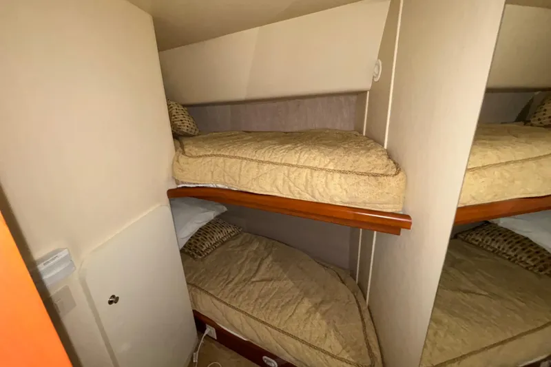 Slide: The Image of Interior of 2005 Silverton 34 Convertible yacht with kitchen and seating area. - 27