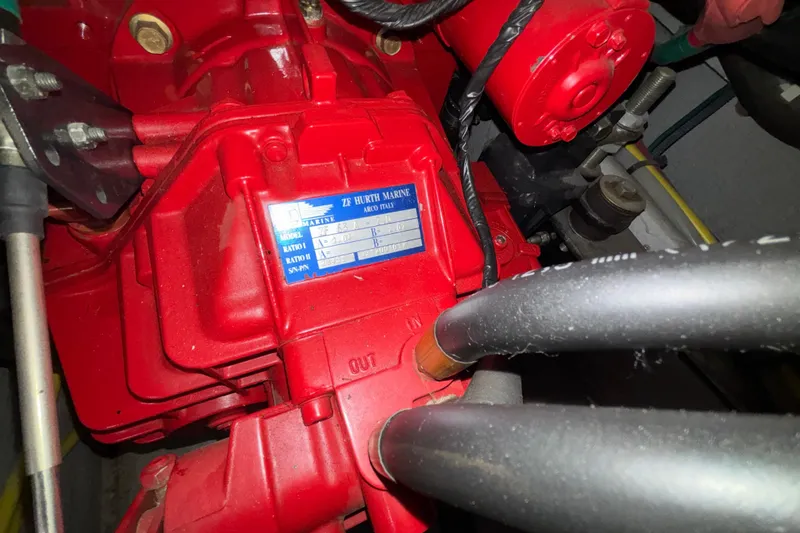 Slide: The Image of Engine compartment of a 2005 Silverton 34 Convertible boat, featuring a red engine. - 42