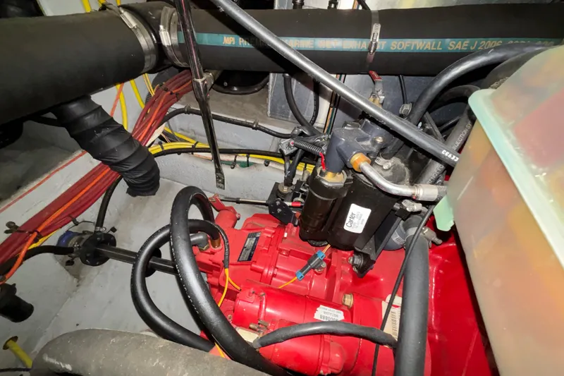 Slide: The Image of Engine room of 2005 Silverton 34 Convertible with red engine components. - 43