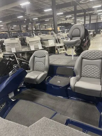 Slide: The Image of 2026 Ikon Boats VLX20 interior with gray seating in a showroom. - 5