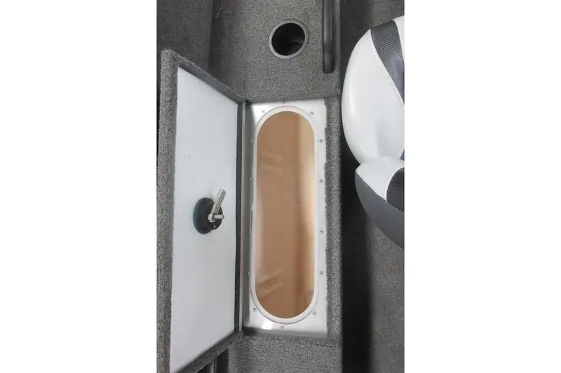 Slide: The Image of 2013 Alumacraft Competitor 175 SC boat storage compartment with open lid and seating area. - 10