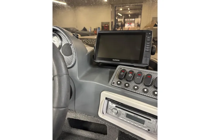 Slide: The Image of 2013 Alumacraft Competitor 175 SC dashboard with Garmin GPS and control panel. - 15