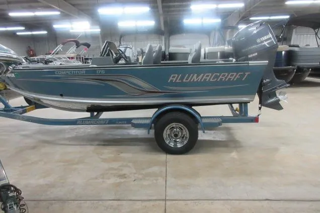 Slide: The Image of 2013 Alumacraft Competitor 175 SC boat on trailer in indoor showroom. - 4