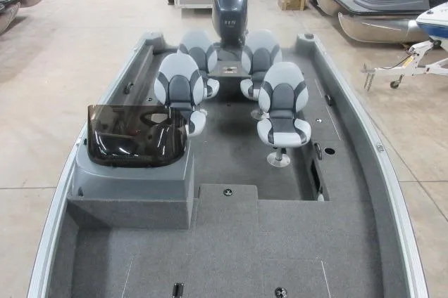 Slide: The Image of 2013 Alumacraft Competitor 175 SC boat interior with four seats and steering console. - 6