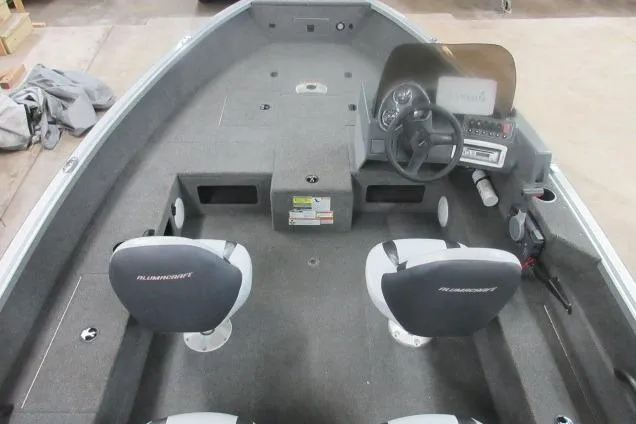 Slide: The Image of 2013 Alumacraft Competitor 175 SC boat interior with steering console and seating. - 7