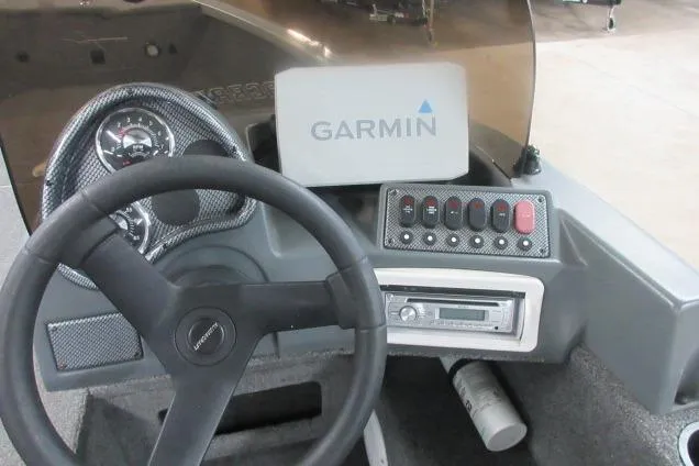 Slide: The Image of 2013 Alumacraft Competitor 175 SC dashboard with Garmin GPS and control panel. - 8