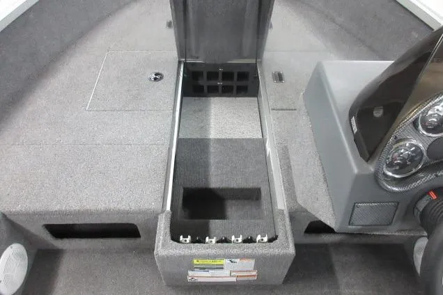 Slide: The Image of 2013 Alumacraft Competitor 175 SC boat interior with storage compartments and dashboard. - 9