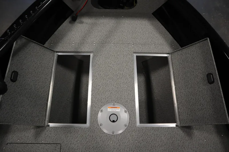 Slide: The Image of Interior of 2026 Crestliner 1850 Kodiak WT with open storage compartments. - 16