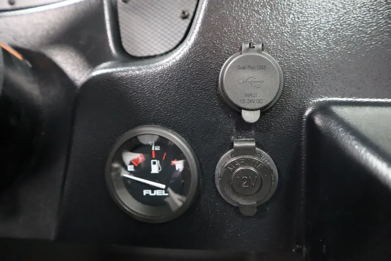 Slide: The Image of Dashboard of 2026 Crestliner 1850 Kodiak WT with fuel gauge and USB ports. - 28