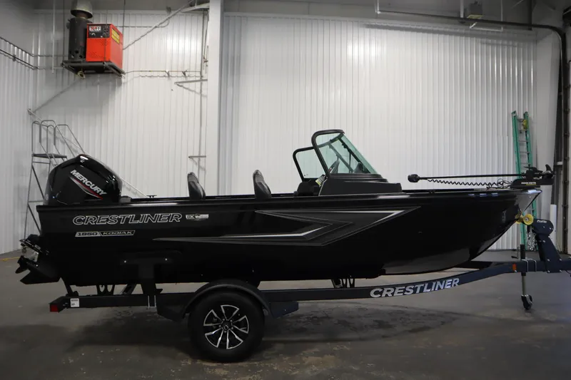Slide: The Image of 2026 Crestliner 1850 Kodiak WT boat in a warehouse. - 3