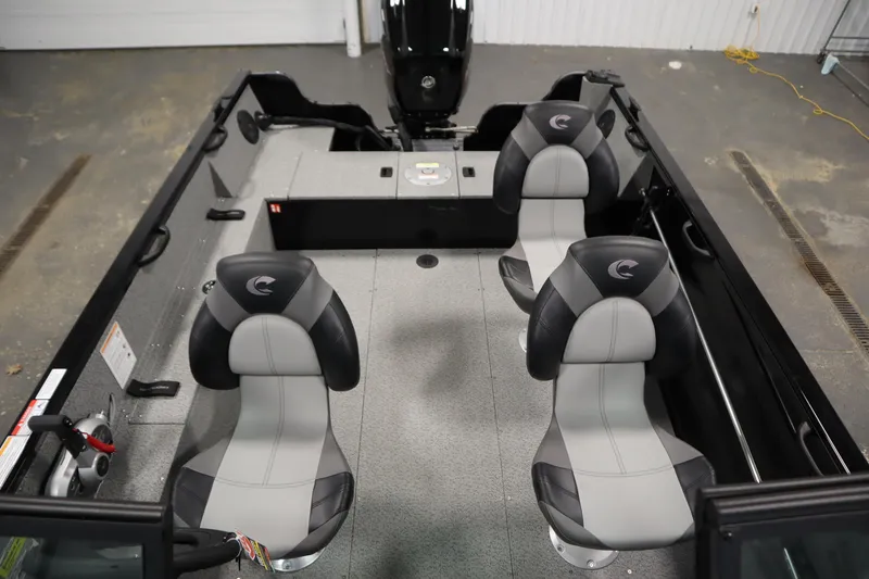 Slide: The Image of 2026 Crestliner 1850 Kodiak WT boat interior with four gray and black seats. - 33