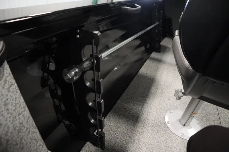 Slide: The Image of 2026 Crestliner 1850 Kodiak WT interior with rod storage and seating. - 34