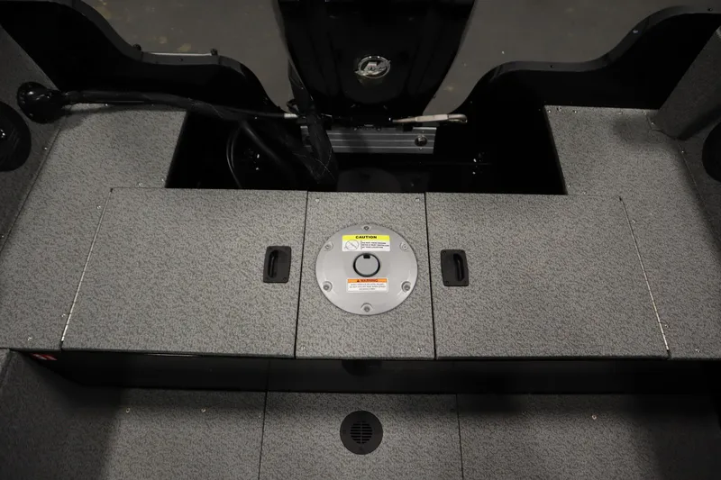 Slide: The Image of Interior view of 2026 Crestliner 1850 Kodiak WT boat, featuring storage compartments. - 37