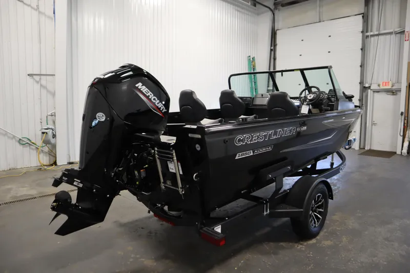 Slide: The Image of 2026 Crestliner 1850 Kodiak WT boat in a garage. - 4