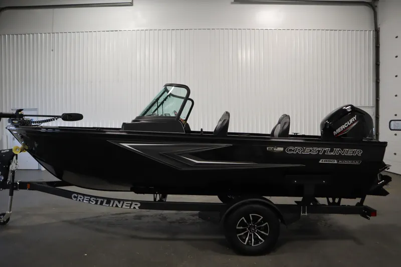 Slide: The Image of 2026 Crestliner 1850 Kodiak WT boat in a garage. - 7