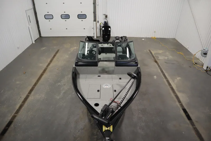 Slide: The Image of 2026 Crestliner 1850 Kodiak WT boat in a garage, top view. - 8