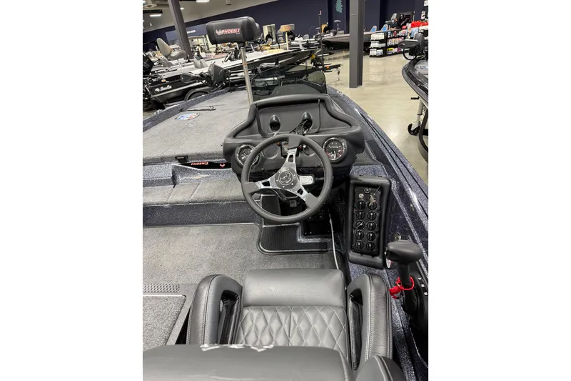 Slide: The Image of 2026 Phoenix 721 ZXL boat interior with steering wheel and control panel. - 7