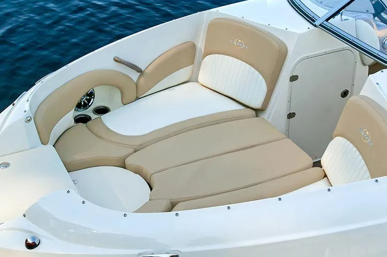 Slide: The Image of Manufacturer Provided Image: 2018 Stingray 214 LR boat with beige and white cushioned seating. - 8