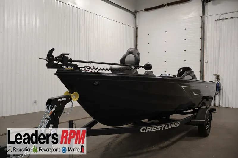 The Image of 2026 Crestliner 1850 Kodiak SC fishing boat in showroom, featuring Minn Kota trolling motor. - 0