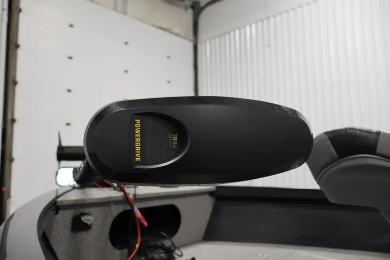 Slide: The Image of 2026 Crestliner 1850 Kodiak SC boat with PowerDrive trolling motor in a garage. - 11