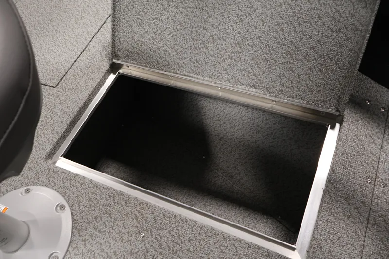 Slide: The Image of Open storage compartment in 2026 Crestliner 1850 Kodiak SC boat interior. - 14