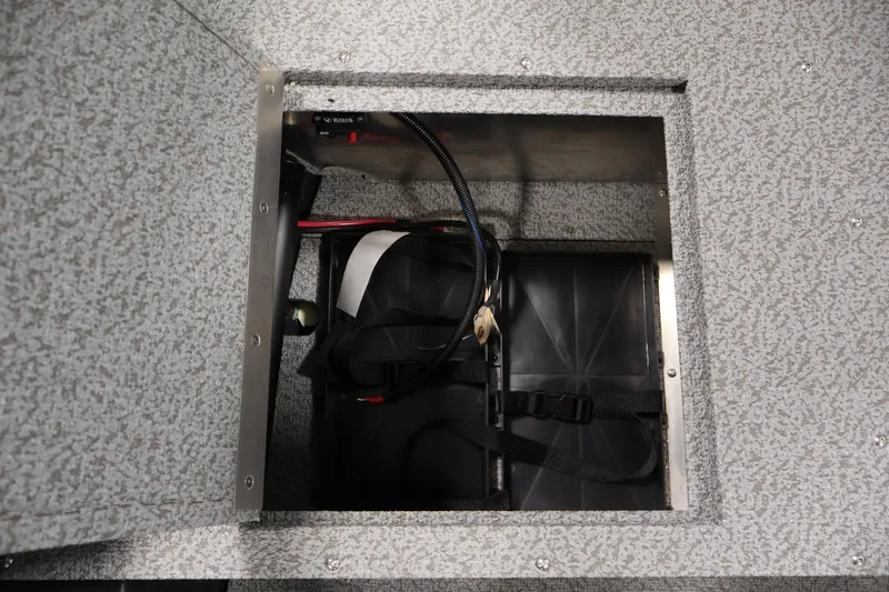 Slide: The Image of Battery compartment of 2026 Crestliner 1850 Kodiak SC boat, featuring secure wiring. - 16