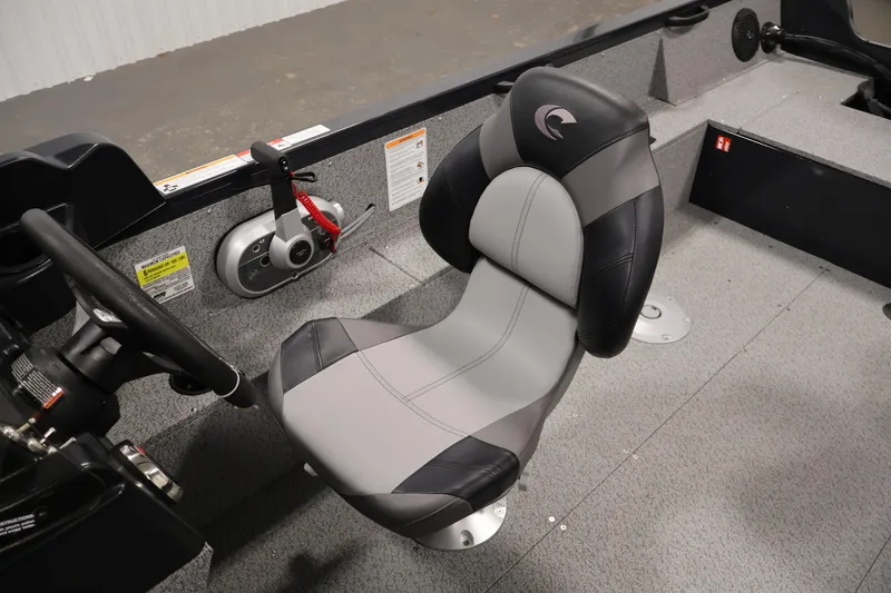 Slide: The Image of 2026 Crestliner 1850 Kodiak SC boat interior with steering wheel and seat. - 24