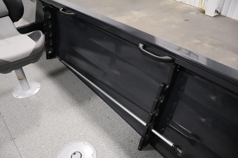 Slide: The Image of 2026 Crestliner 1850 Kodiak SC interior with seating and storage features. - 25