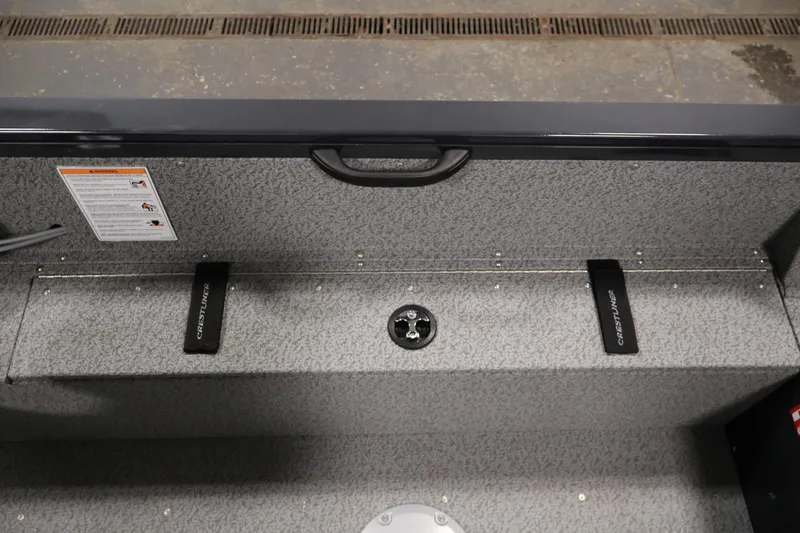 Slide: The Image of Interior view of 2026 Crestliner 1850 Kodiak SC boat, featuring storage compartments. - 27