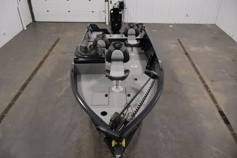 Slide: The Image of 2026 Crestliner 1850 Kodiak SC fishing boat in a garage setting. - 8