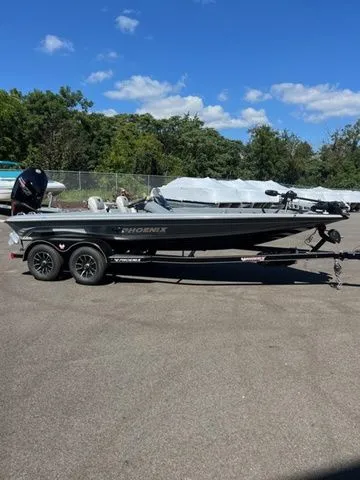 The Image of 2026 Phoenix Bass Boats 819 ZXL on trailer, parked outdoors under blue sky. - 1