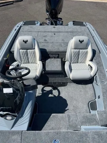 Slide: The Image of 2026 Phoenix Bass Boats 819 ZXL interior with dual seats and steering wheel. - 4