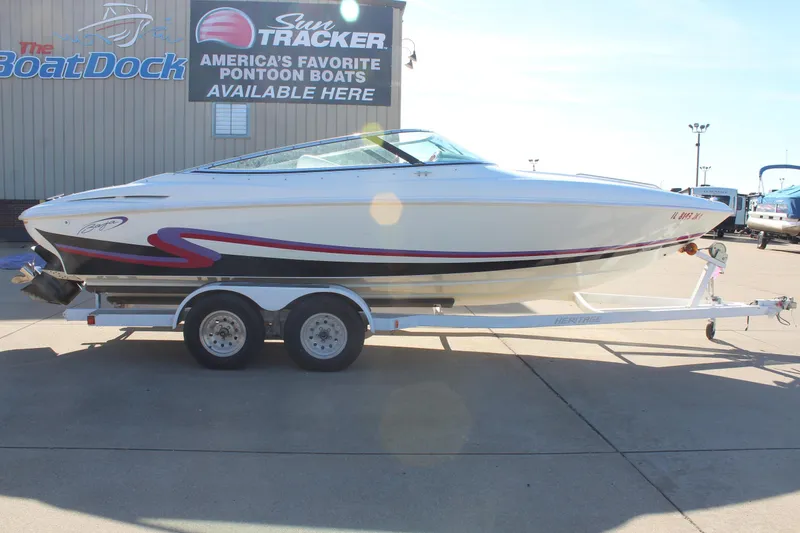 The Image of 1996 Baja 232 speedboat on trailer at The Boat Dock dealership. - 1