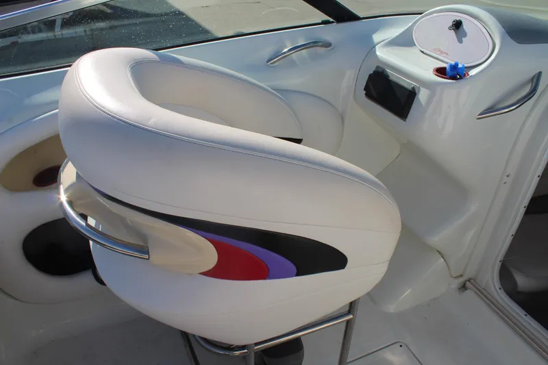 Slide: The Image of White leather seat in 1996 Baja 232 boat interior, featuring colorful accents and sleek design. - 18