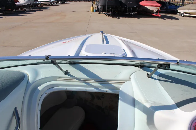 Slide: The Image of 1996 Baja 232 boat interior view with open cabin hatch. - 24
