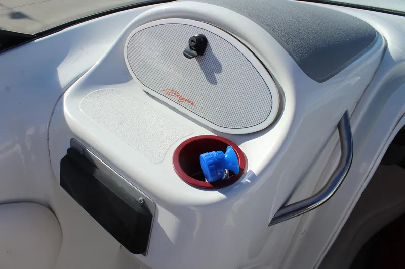 Slide: The Image of Interior of a 1996 Baja 232 boat with speaker and cup holder. - 25