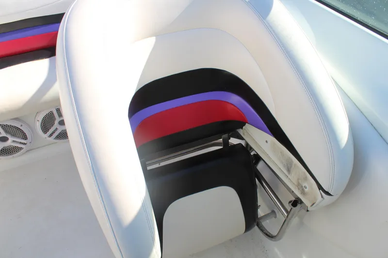 Slide: The Image of 1996 Baja 232 boat interior with colorful seat design and speaker system. - 26