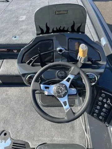 Slide: The Image of 2026 Phoenix Bass Boats 921 Elite X dashboard with steering wheel and controls. - 3