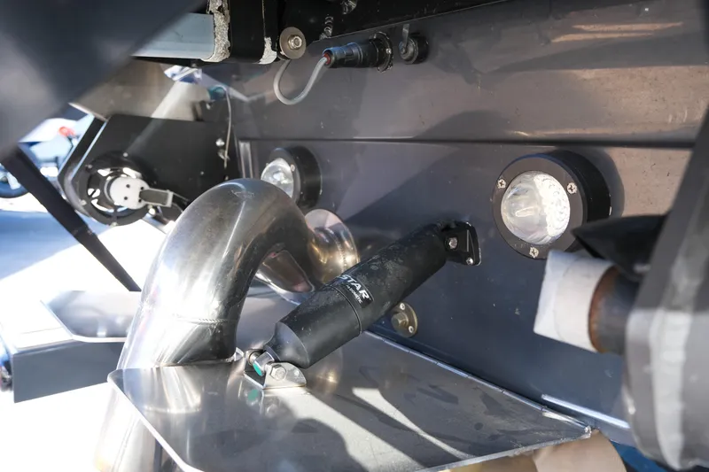 Slide: The Image of Close-up of 2025 Supra SE550 boat engine components and exhaust system. - 11