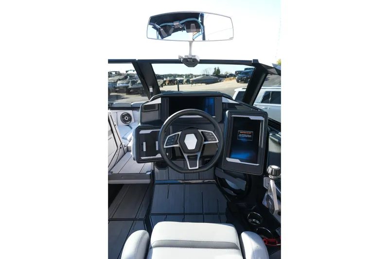 Slide: The Image of 2025 Supra SE550 boat cockpit with modern steering and digital displays. - 21