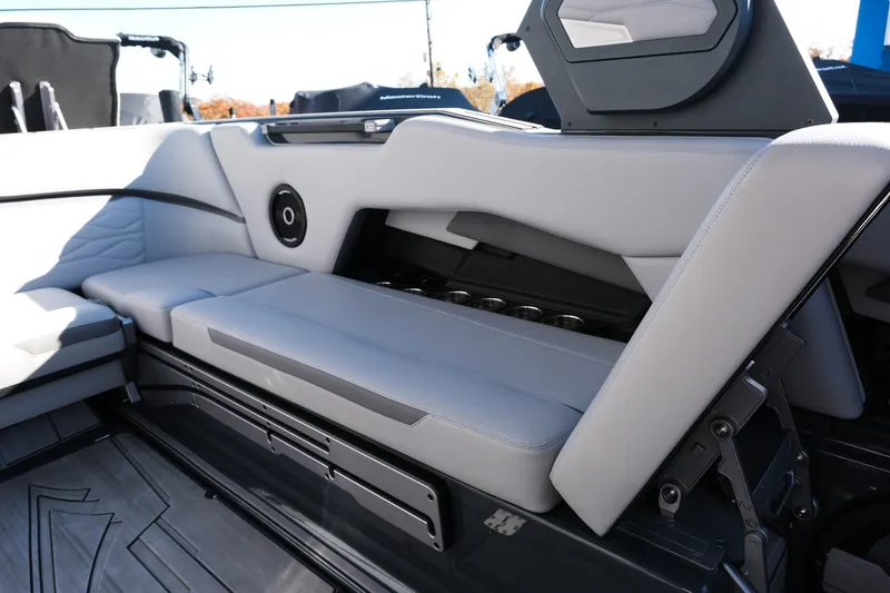Slide: The Image of 2025 Supra SE550 boat interior with sleek seating and integrated speaker system. - 23