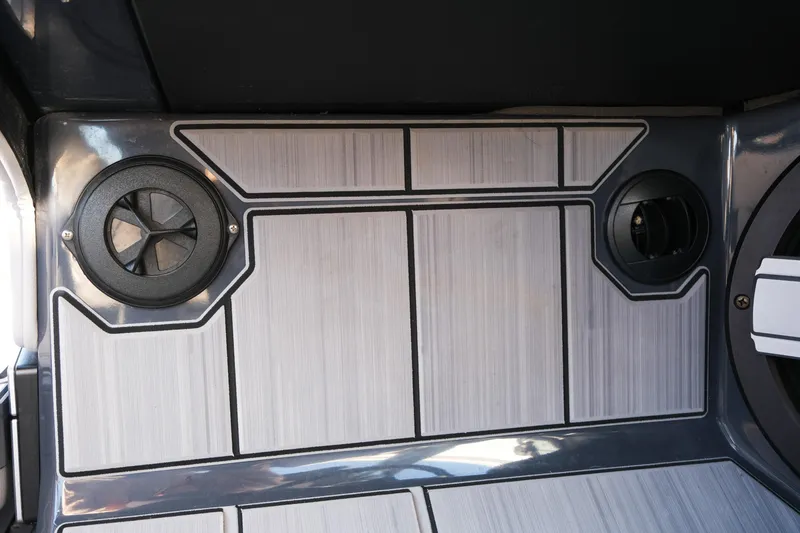 Slide: The Image of 2025 Supra SE550 interior with sleek speaker design and modern paneling. - 26