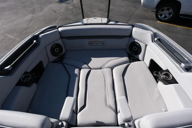 Slide: The Image of 2025 Supra SE550 boat interior with luxurious seating and integrated speakers. - 28