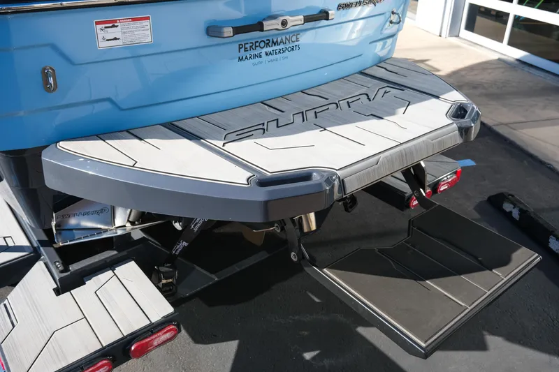 Slide: The Image of 2025 Supra SE550 boat with swim platform and step, showcasing marine performance features. - 6