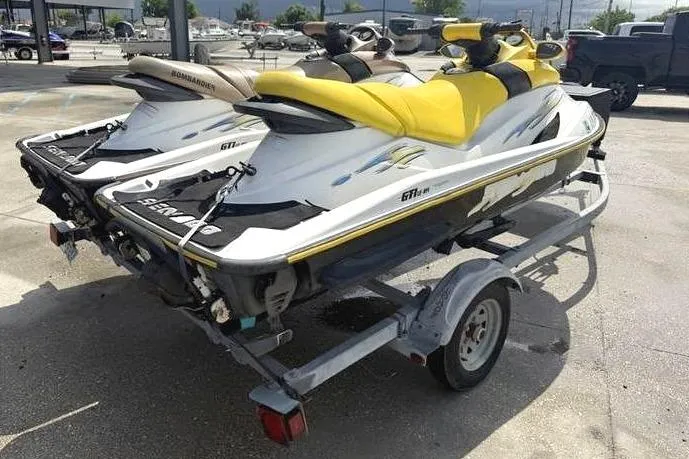 Slide: The Image of 2005 Sea-Doo GTI LE jet ski on trailer outdoors. - 2